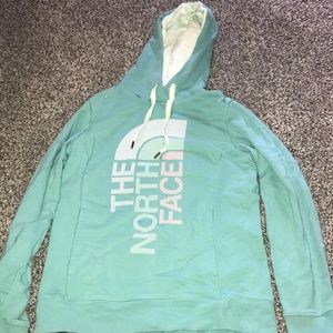 Mint blue hoodie that says the north face